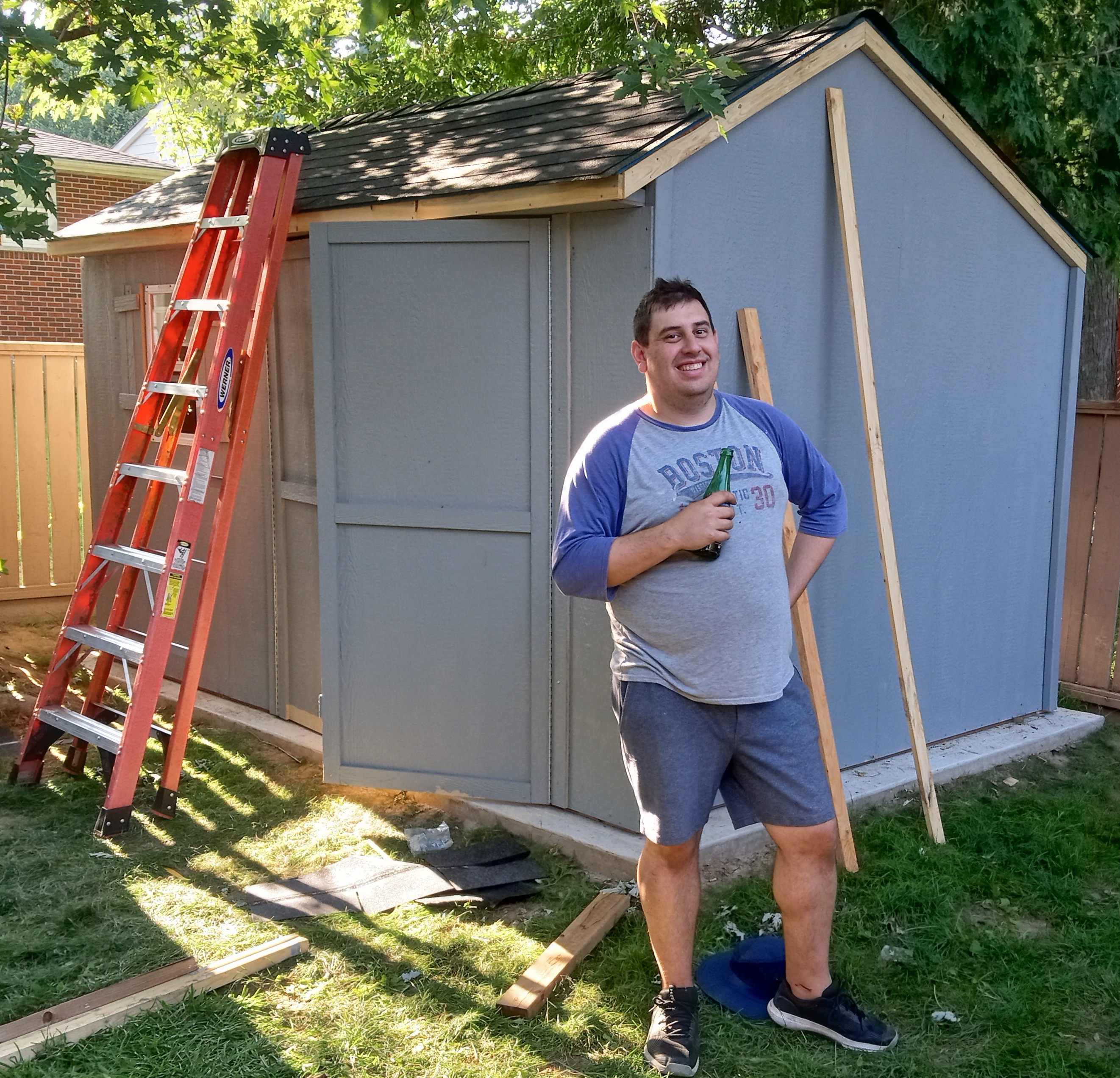 July 28, 2024: Alex posing in front of his new shed